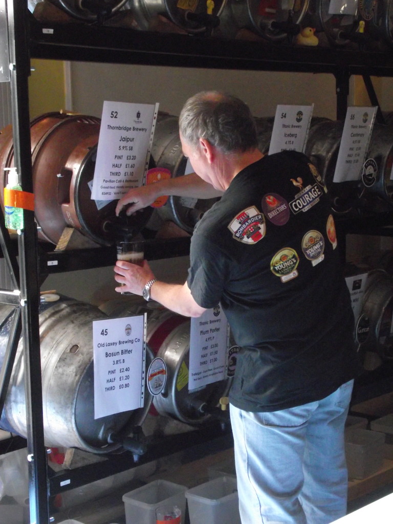 Beer being poured by gravity into the glass